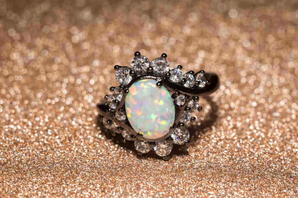 Beautiful opal engagement ring in a vintage-inspired halo setting