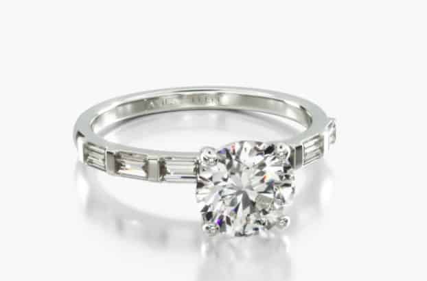 bar setting with baguettes and round cut diamond center