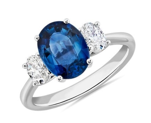 engagement ring with Sapphire oval with two diamond oval shapes